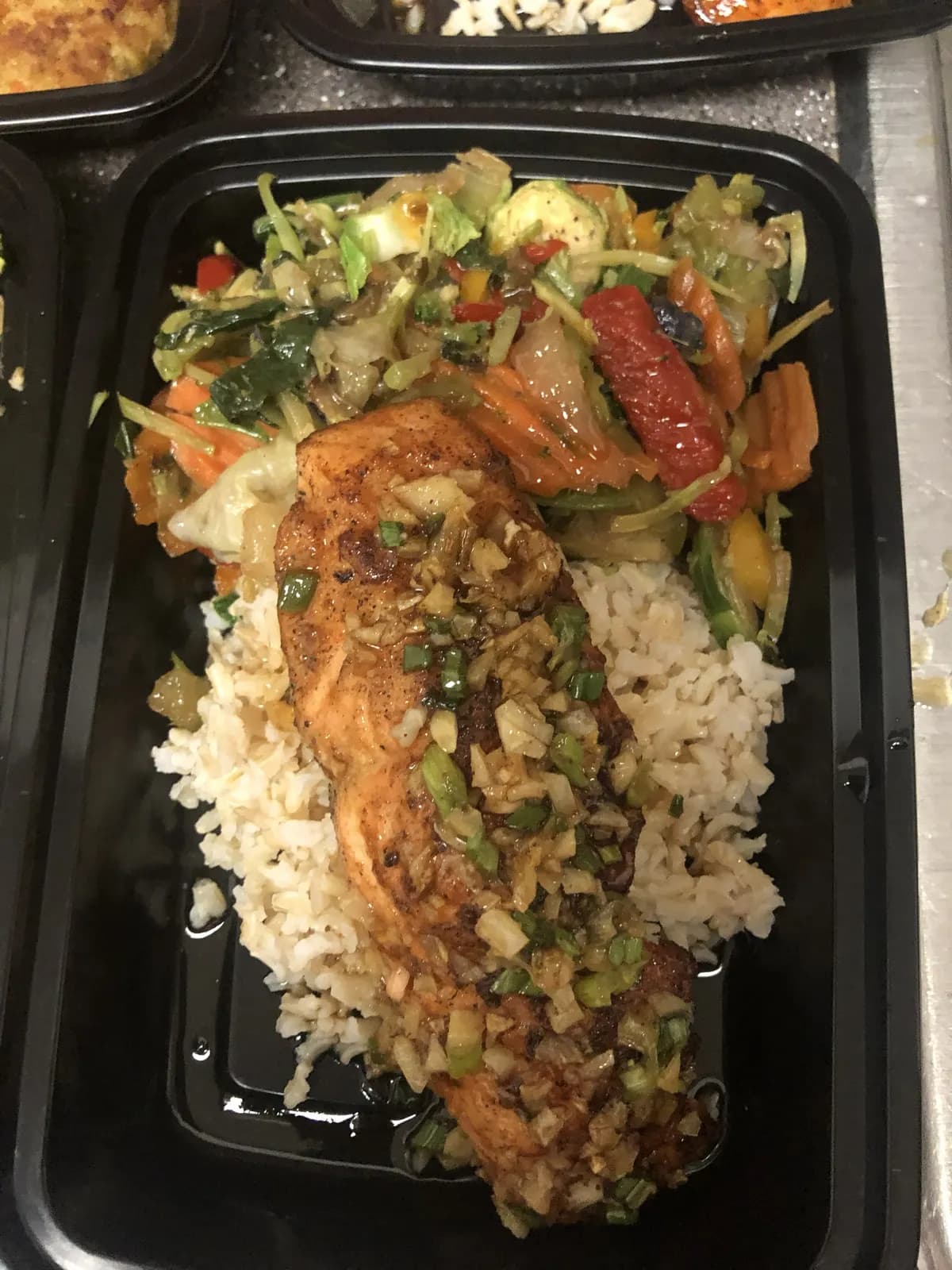Salmon meal prep over rice and vegetables