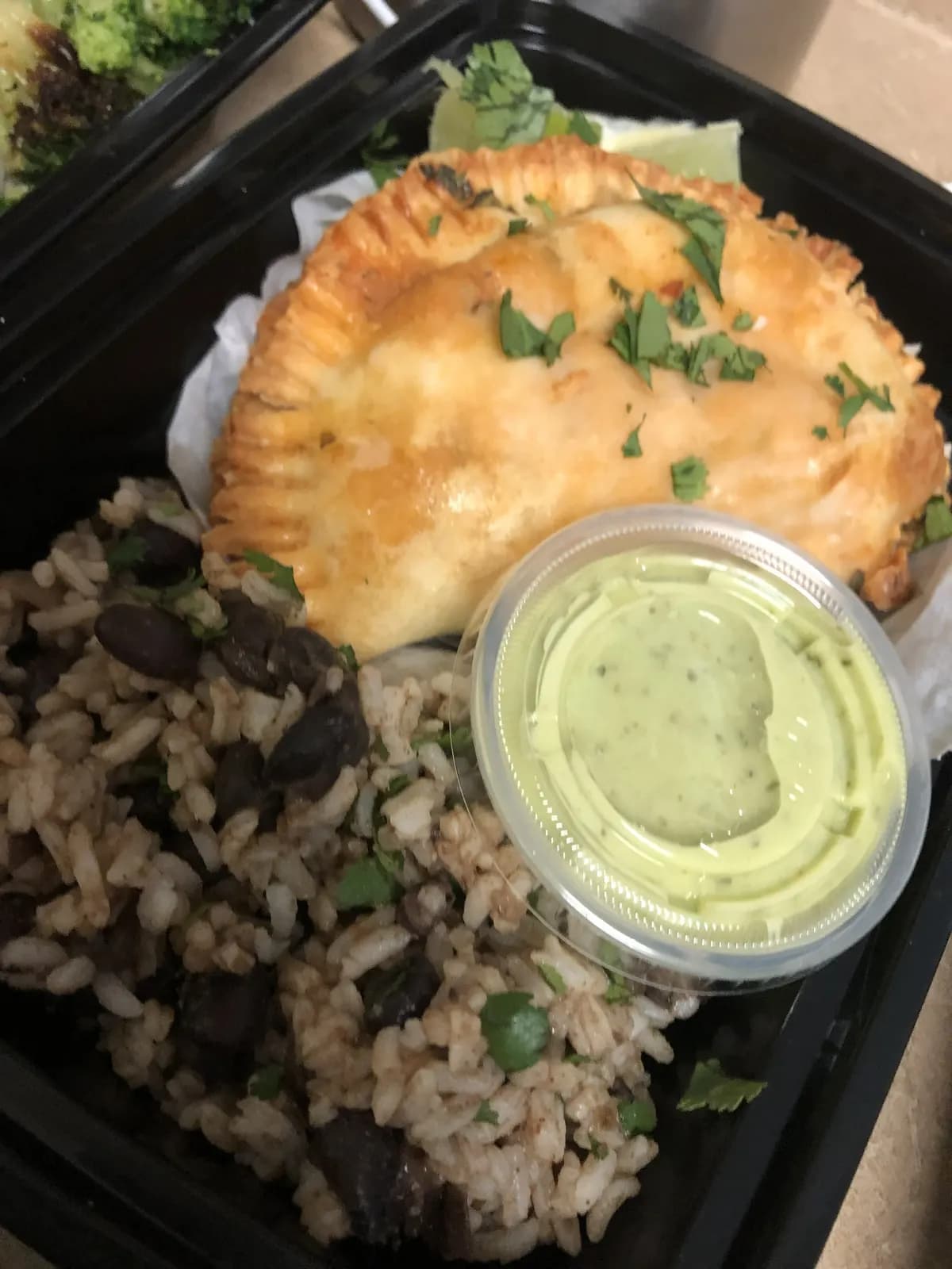 Meal prep plate with rice and a pastry